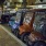 a row of golf carts parked on the side of a street
