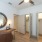 a room with a desk and a mirror