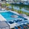 a swimming pool with lounge chairs