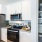 a kitchen with white cabinets