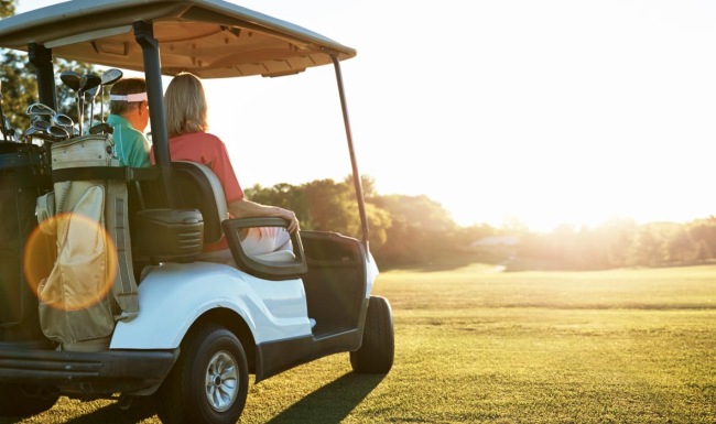 Find your perfect fit at Inspire Wildwood a golf cart with people in it