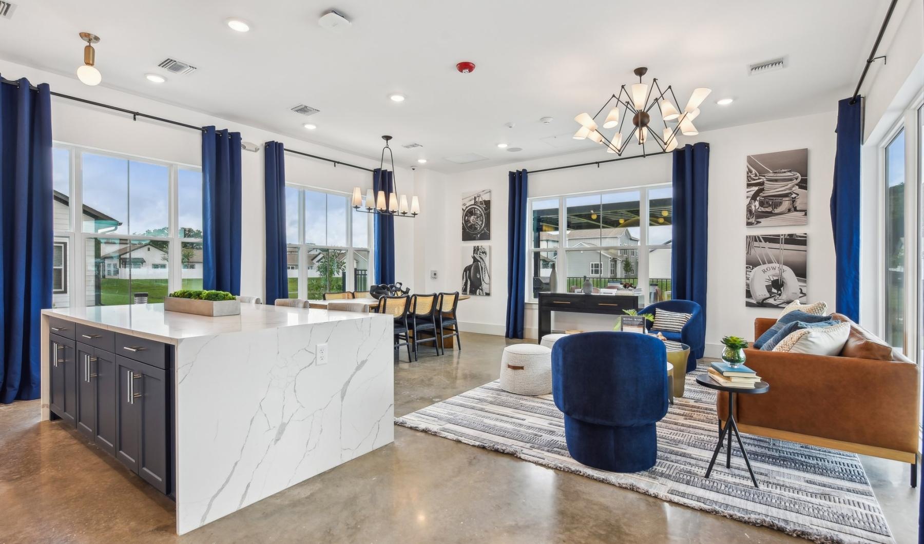 Take advantage of all Inspire Wildwood has to offer a large room with a bar and chairs